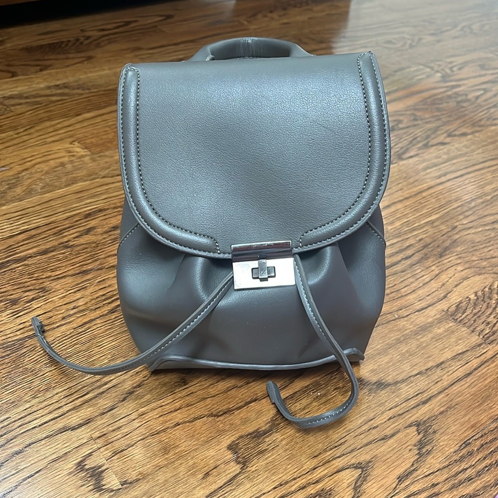 Grey back pack with adjustable straps